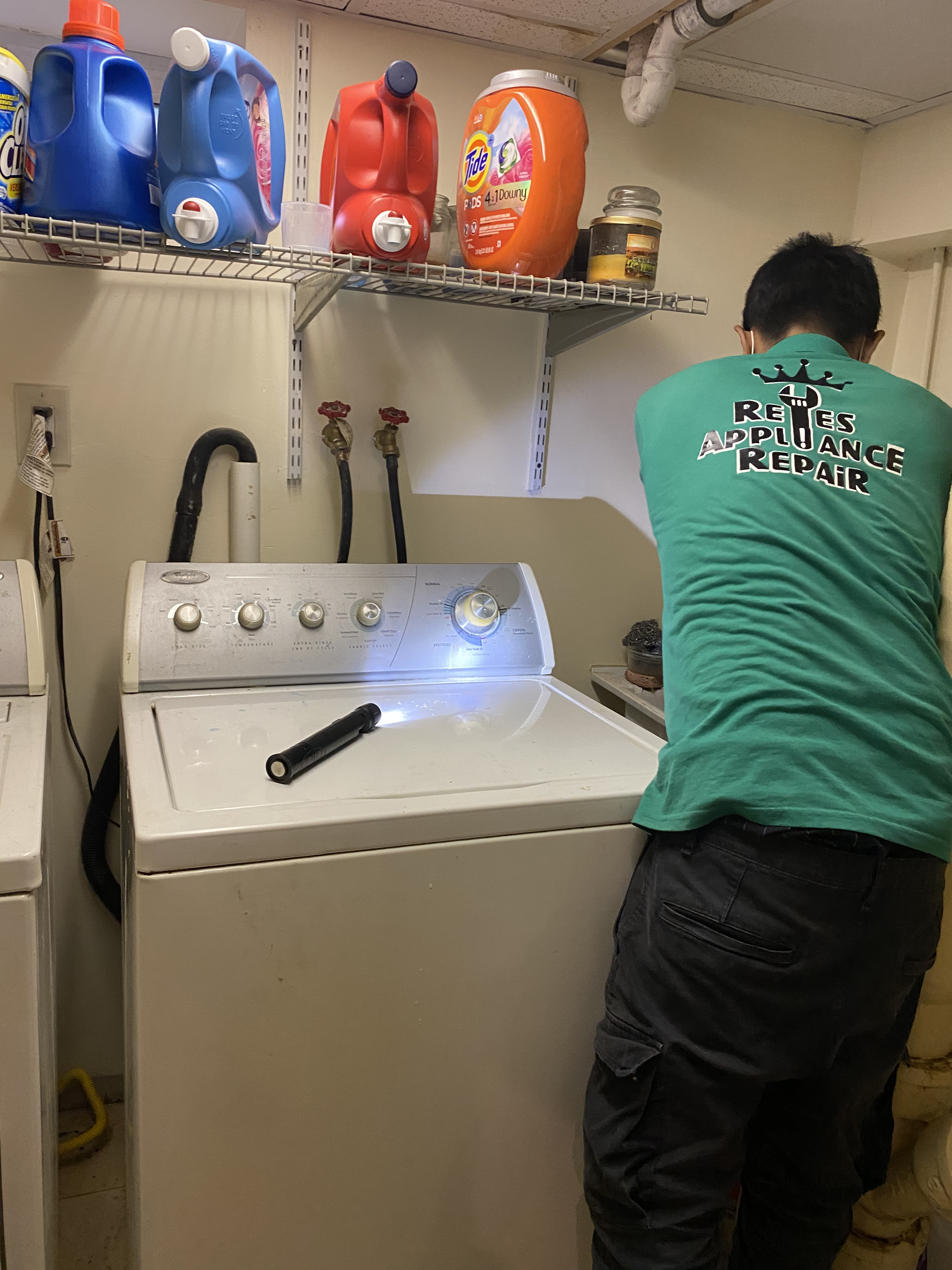 Reyes Appliance Repair technician working on washing machine